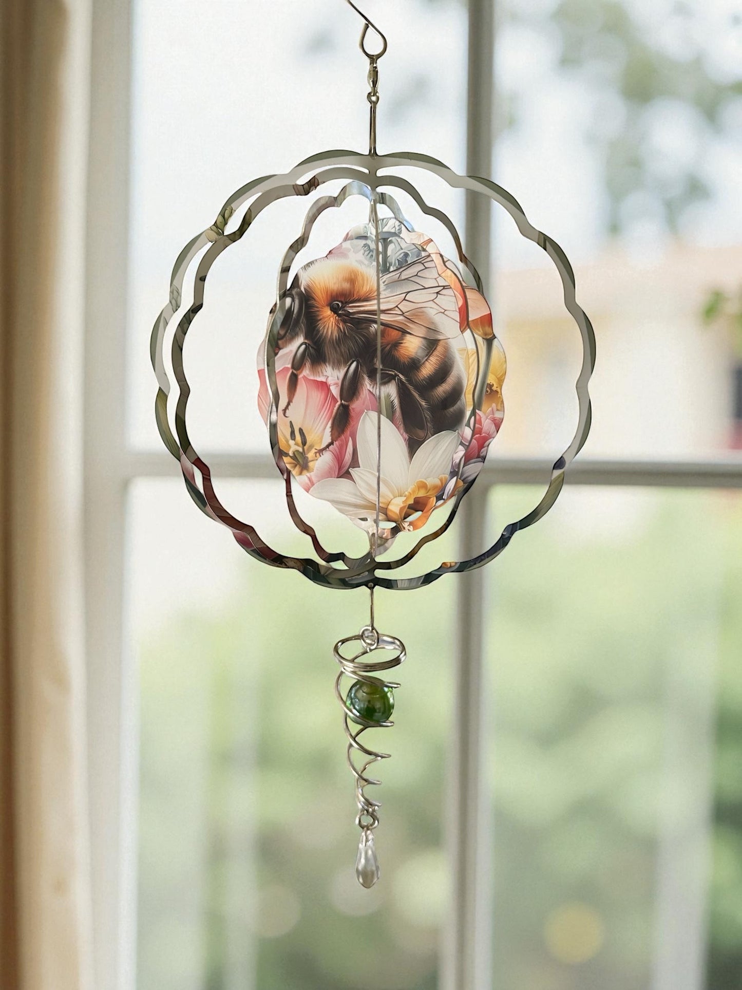 Wind spinner with included stabilizer tail